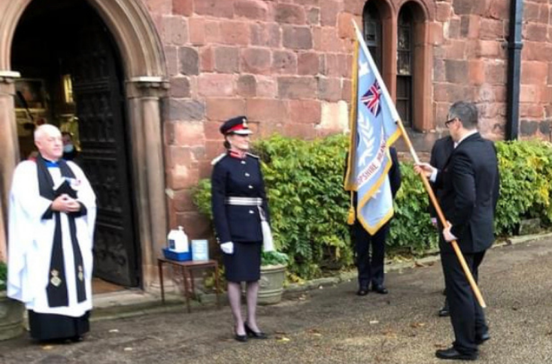 HM Lord-Lieutenant of Shropshire, Anna Turner, receives the Standard from the Shropshire Korean War Veterans Association