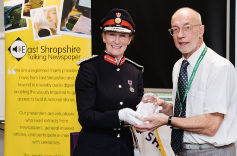 Lord Lieutenant of Shropshire, Anna Turner. presents Shropshire Talking Newspaper Chairman Robert Green with their QAVS