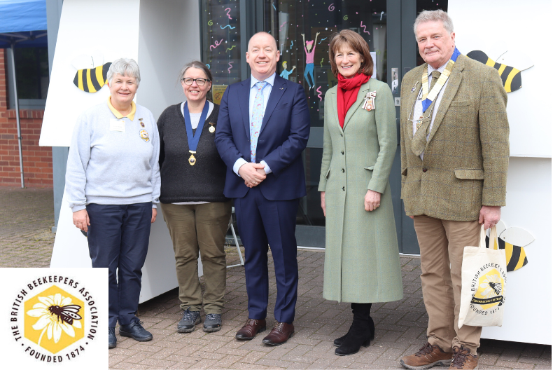 The Lord-Lieutenant of Shropshire, Mrs Anna Turner, helps the BBKA to celebrate its 150 anniversary at Harper Adams University. She is flanked from left to right by Joyce Nisbet, BBKA Trustee and Spring Convention Committee Chair; Diane Drinkwater, BBKA Chair; Prof Ken Sloan, Harper Adams University Vice-Chancellor; Stephen Barnes, BBKA President. Photo credit: Mark Hunter